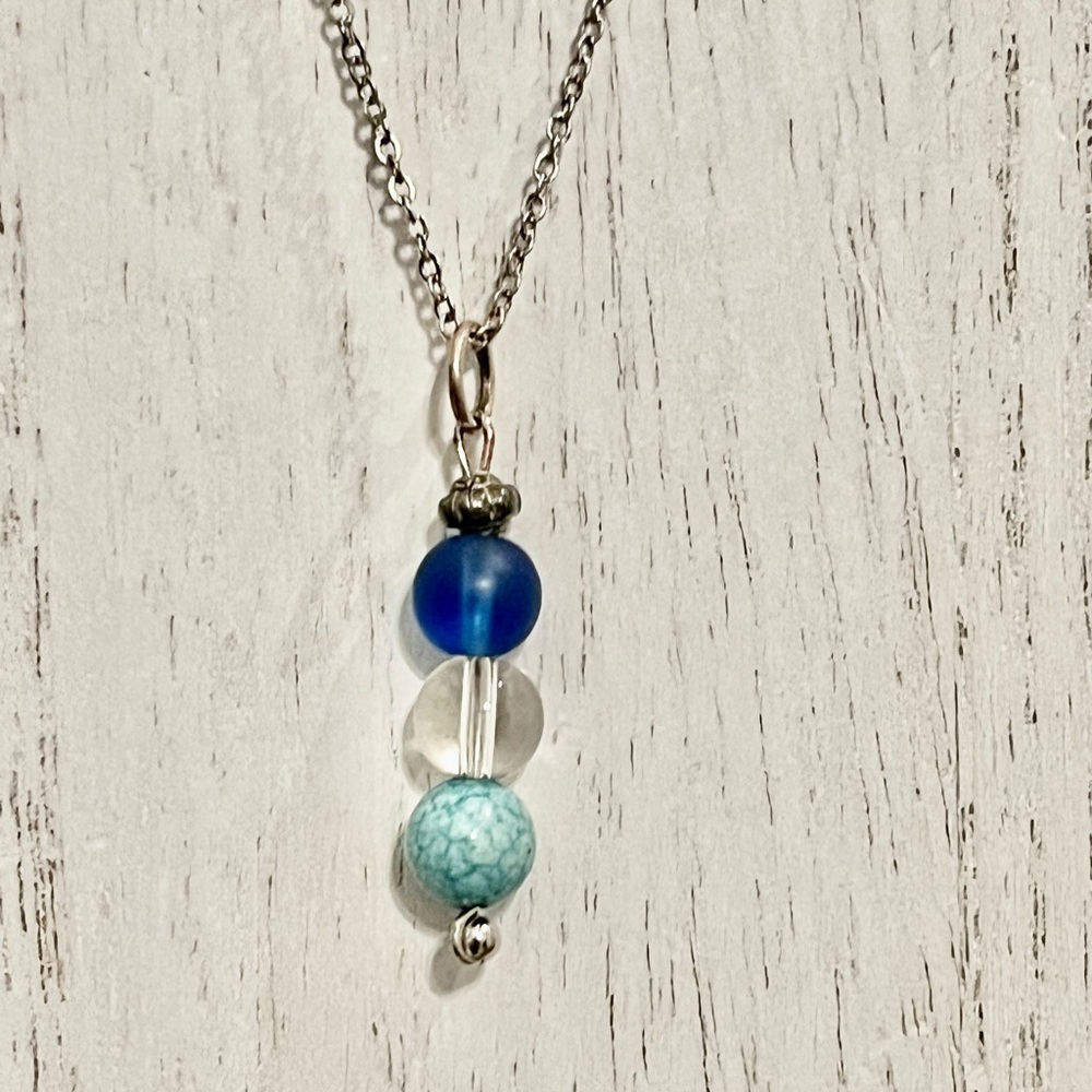 Beautiful boho bead necklace. Silver toned chain is 18 inches.